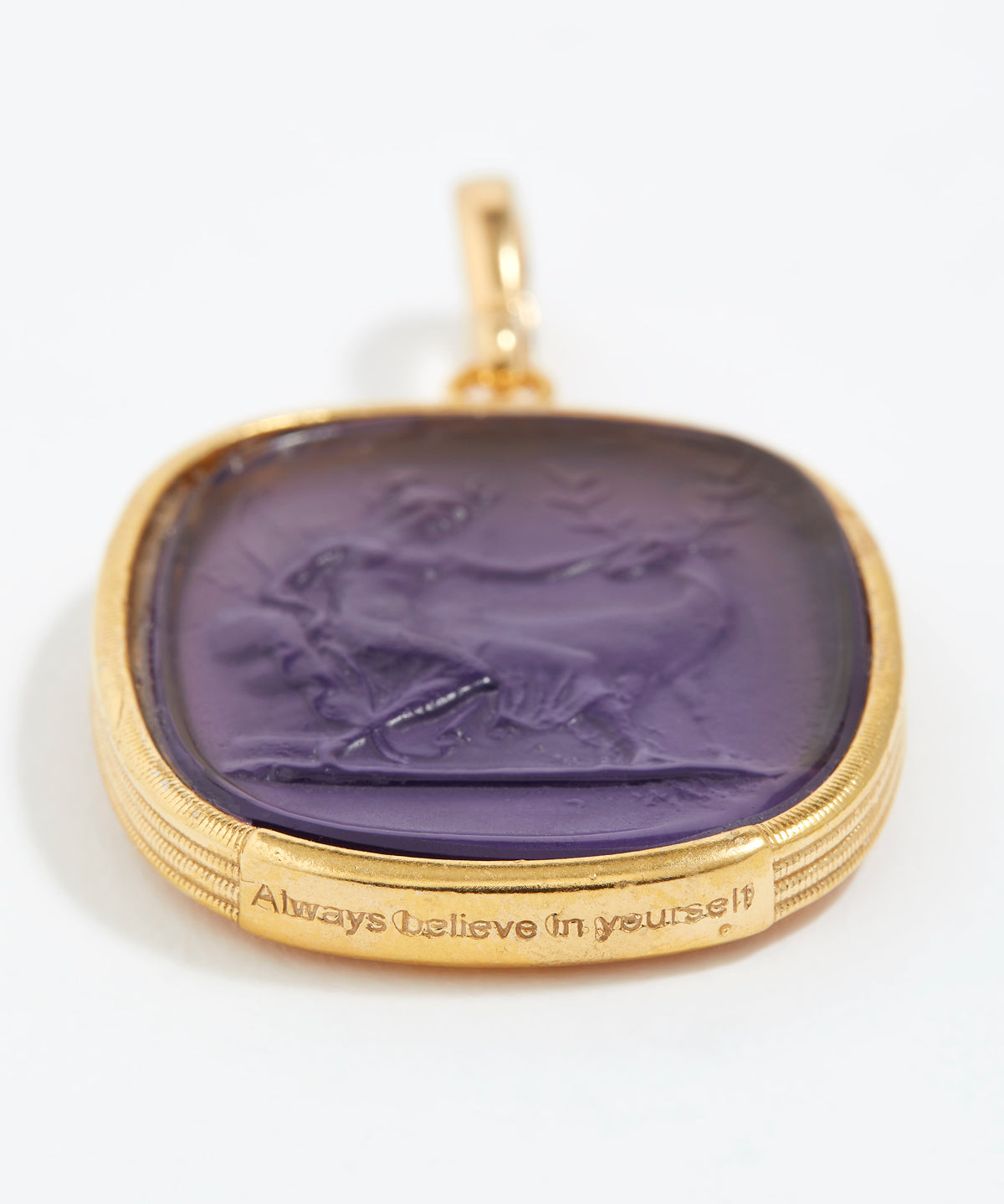 Gold pendant with purple stone and engraved text  "always believe in yourself" on a white background
