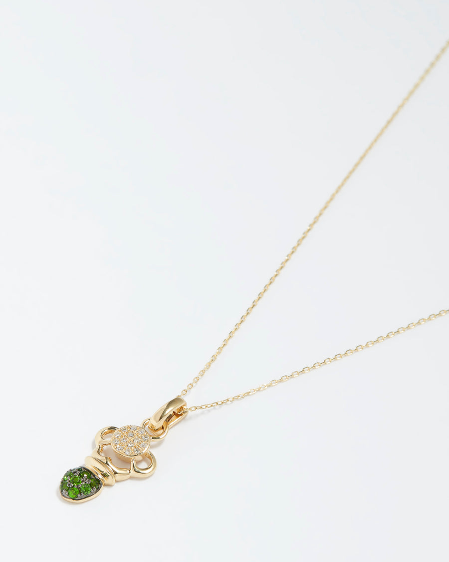 scarab beetle charm made of gold and diamonds and green diopside gemstones, product shot on necklace chain