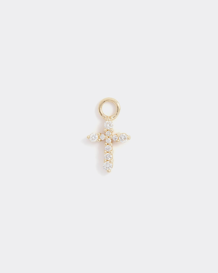 small cross charm made of gold and diamonds, to be worn on an earring or necklace, product shot 