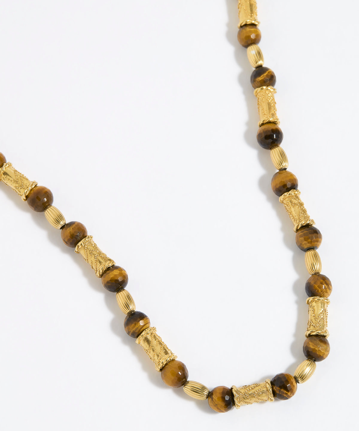 Beaded necklace with gold and tigers eye beads on white background