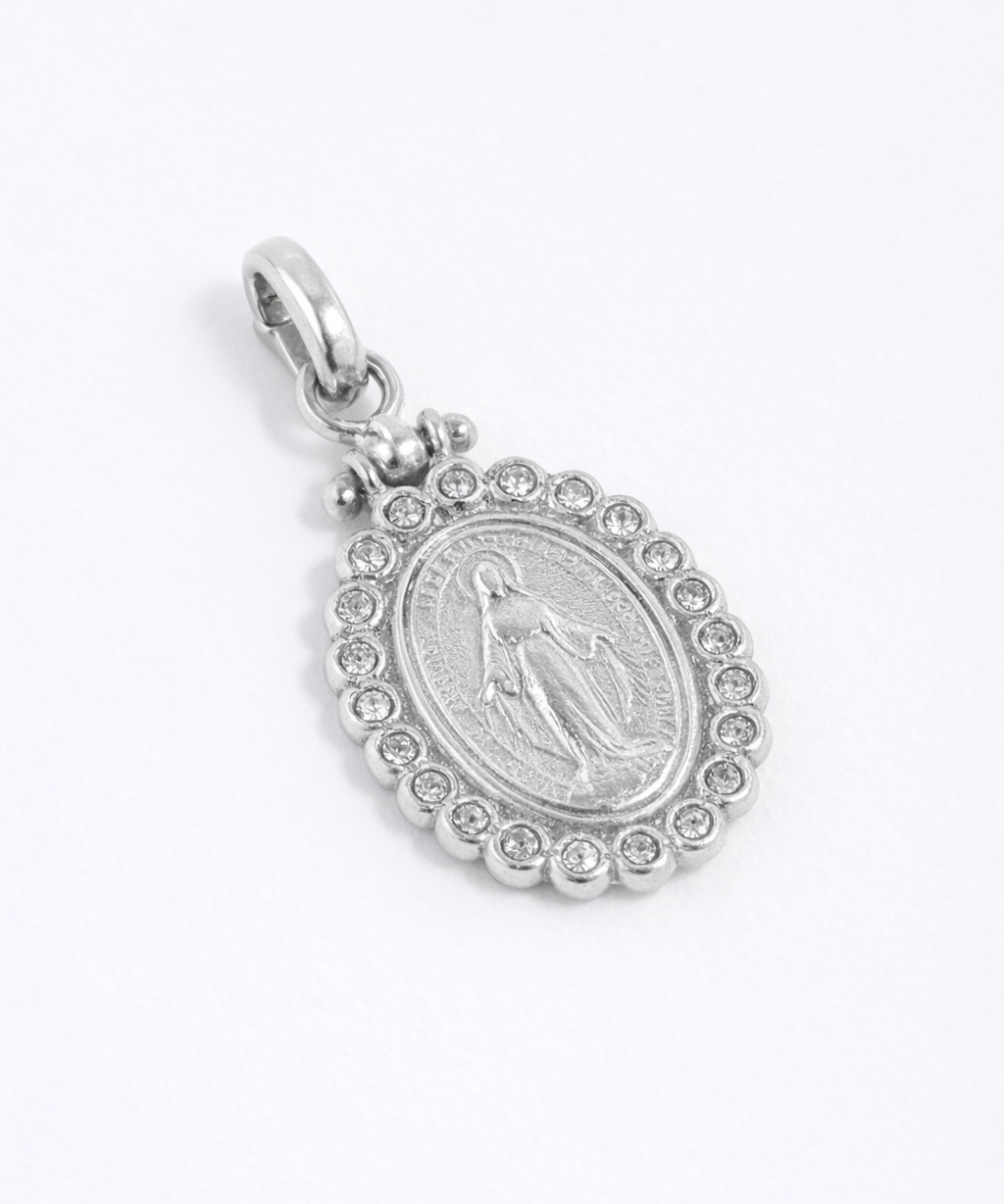 Silver oval shaped charm with crystal surround featuring image of the Madonna. 