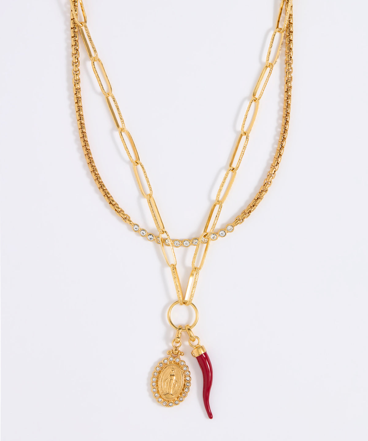 Gold chain necklace set with red cornucopia and crystal pendant charms on a white background