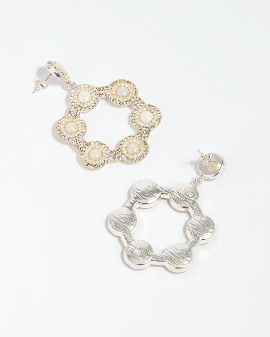 image of clear crystal silver hoop earrings on a whte background showing the front and the back 