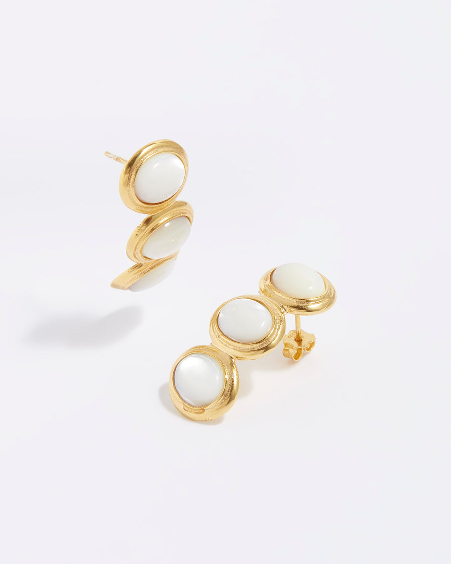 product shot of 3 stone pearl earrings set in yellow gold plated silver in a linear and curved shape