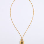 A gold chain necklace with a small rectangular pendant featuring a textured, hammered finish, displayed against a clean white background.