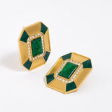 Close up image shot of statement gold and green malachite earrings with clear crystal embellished on a white background