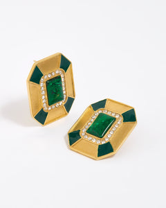 Close up image shot of statement gold and green malachite earrings with clear crystal embellished on a white background