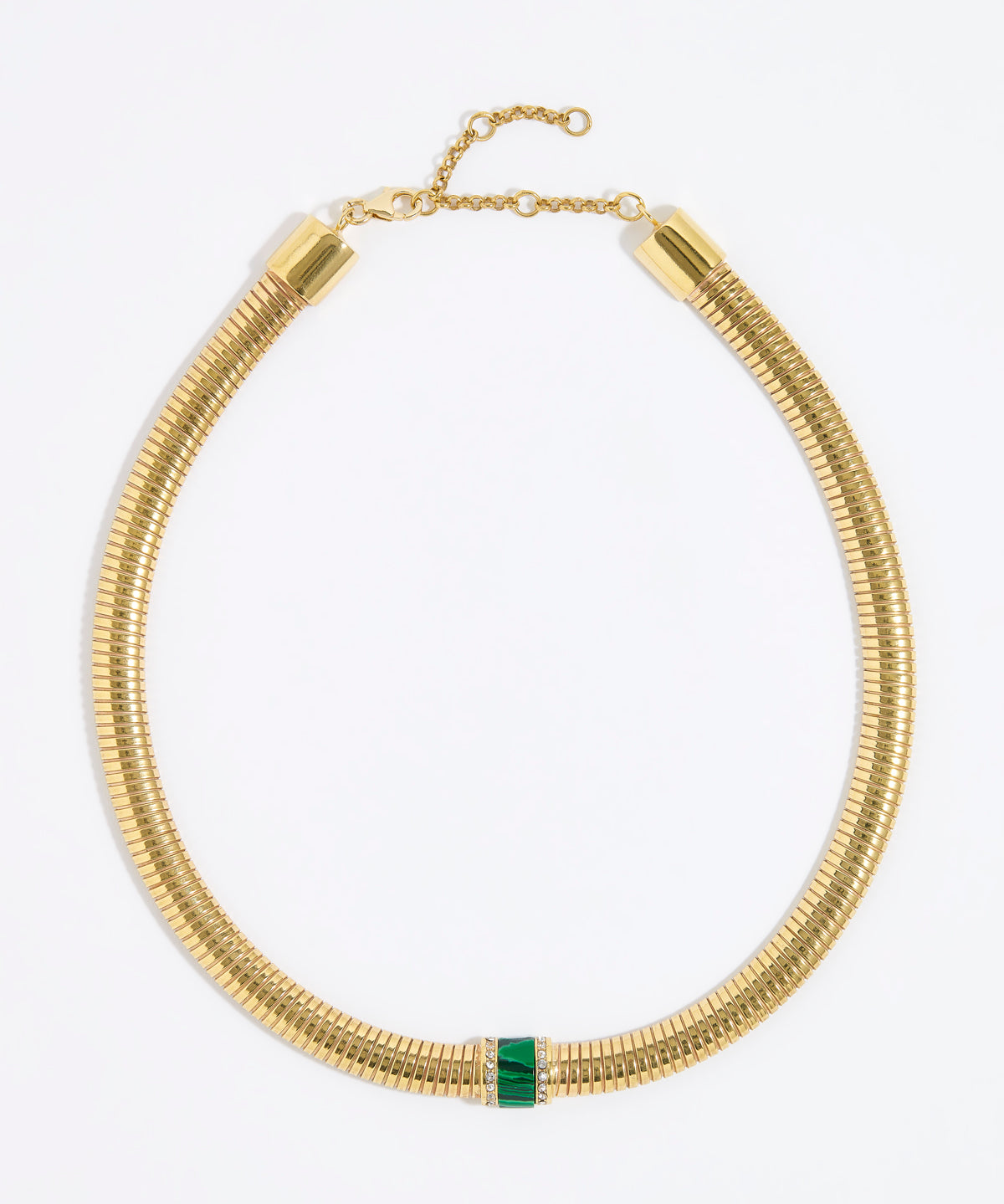 Gold chunky necklace with a central green malachite gemstone embellished with clear crystals on a white background