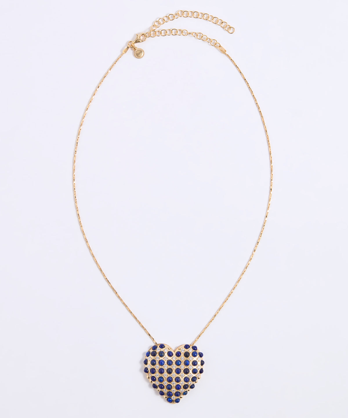 A gold chain necklace with a heart-shaped pendant covered in small dark blue lapis stones and clear sparkling crystals, displayed on a white background.