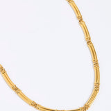 Gold chunky link necklace on a white background link 