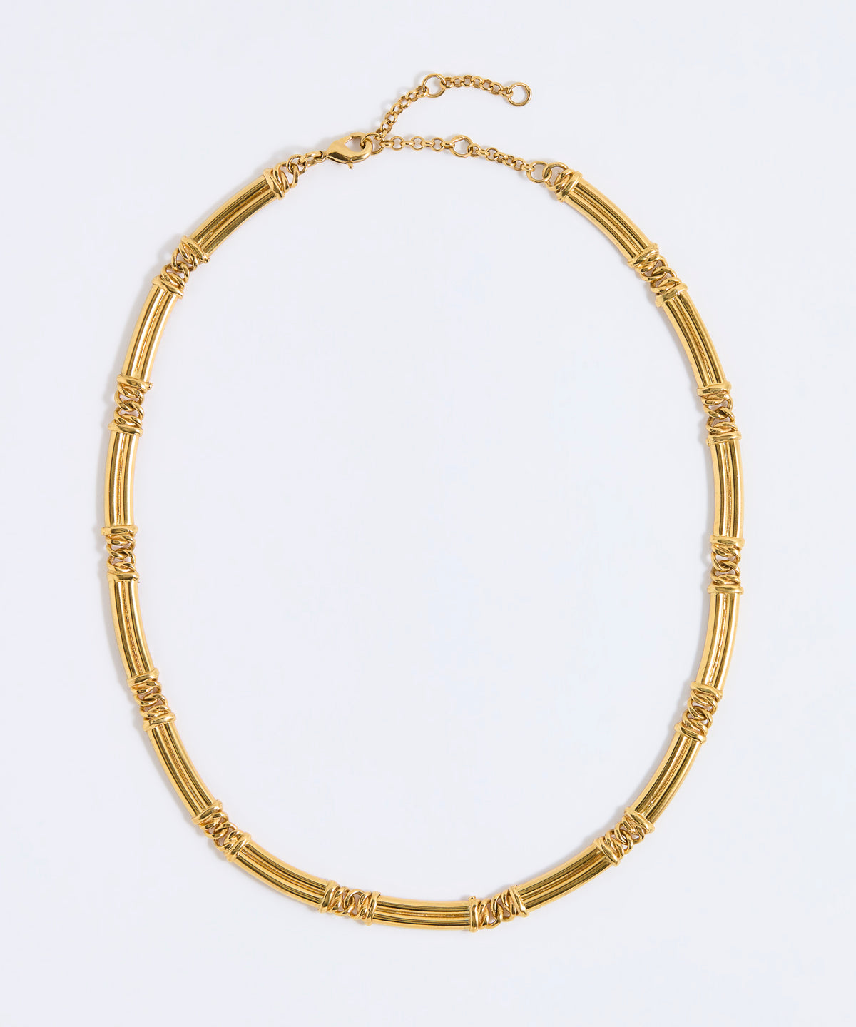 Gold chunky link necklace on a light gray background