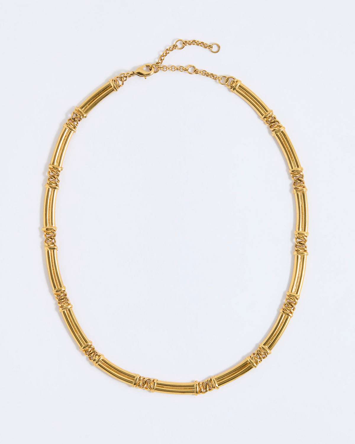 Gold chunky link necklace on a light gray background