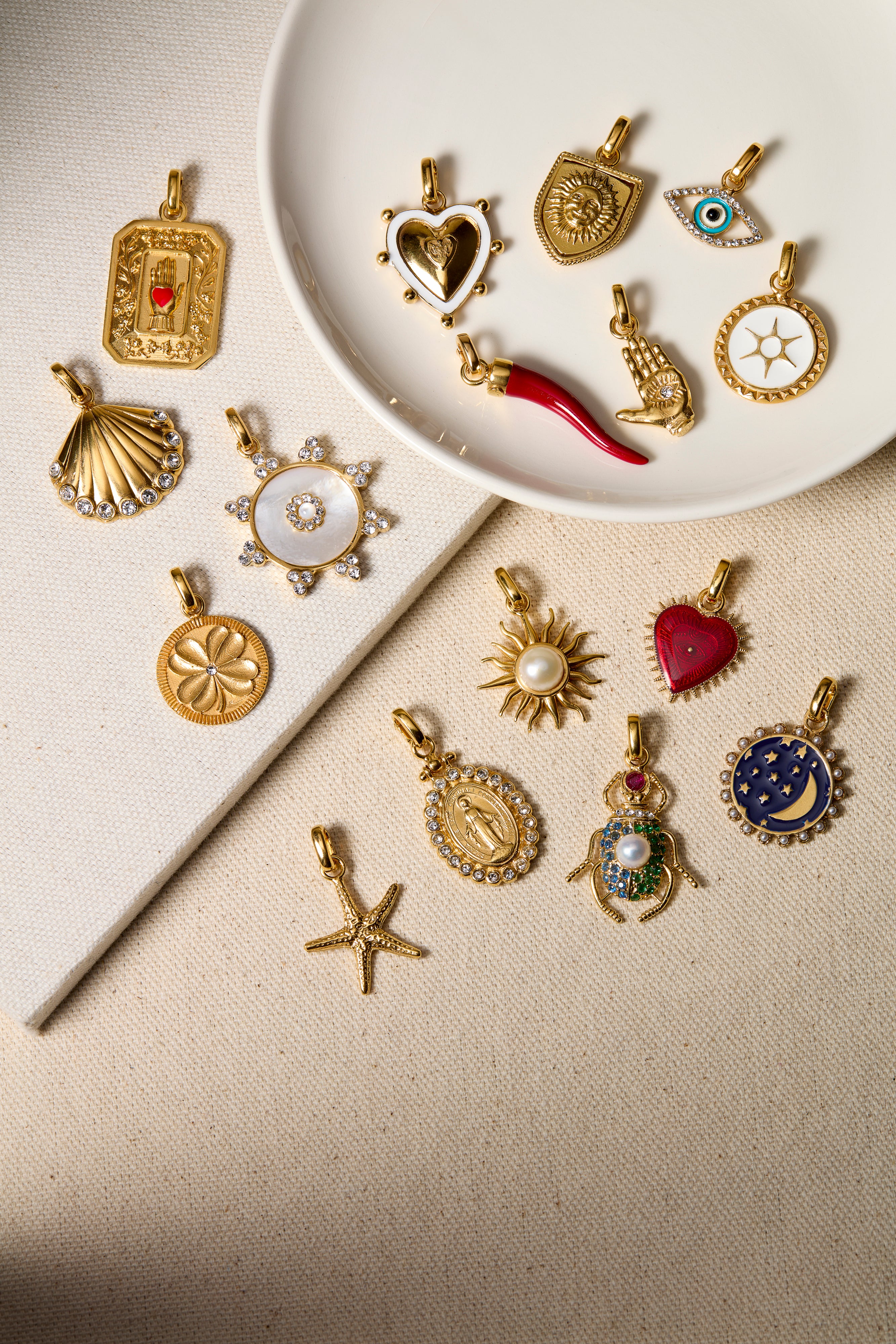 Handcrafted charms on a beige background. 
