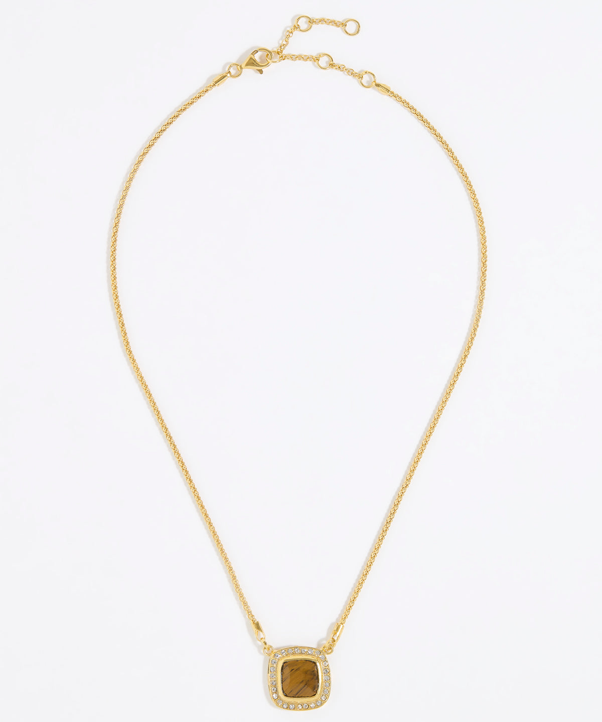 Gold necklace with a square tigers eye stone surrounded by small crystals on a gold chain and white background