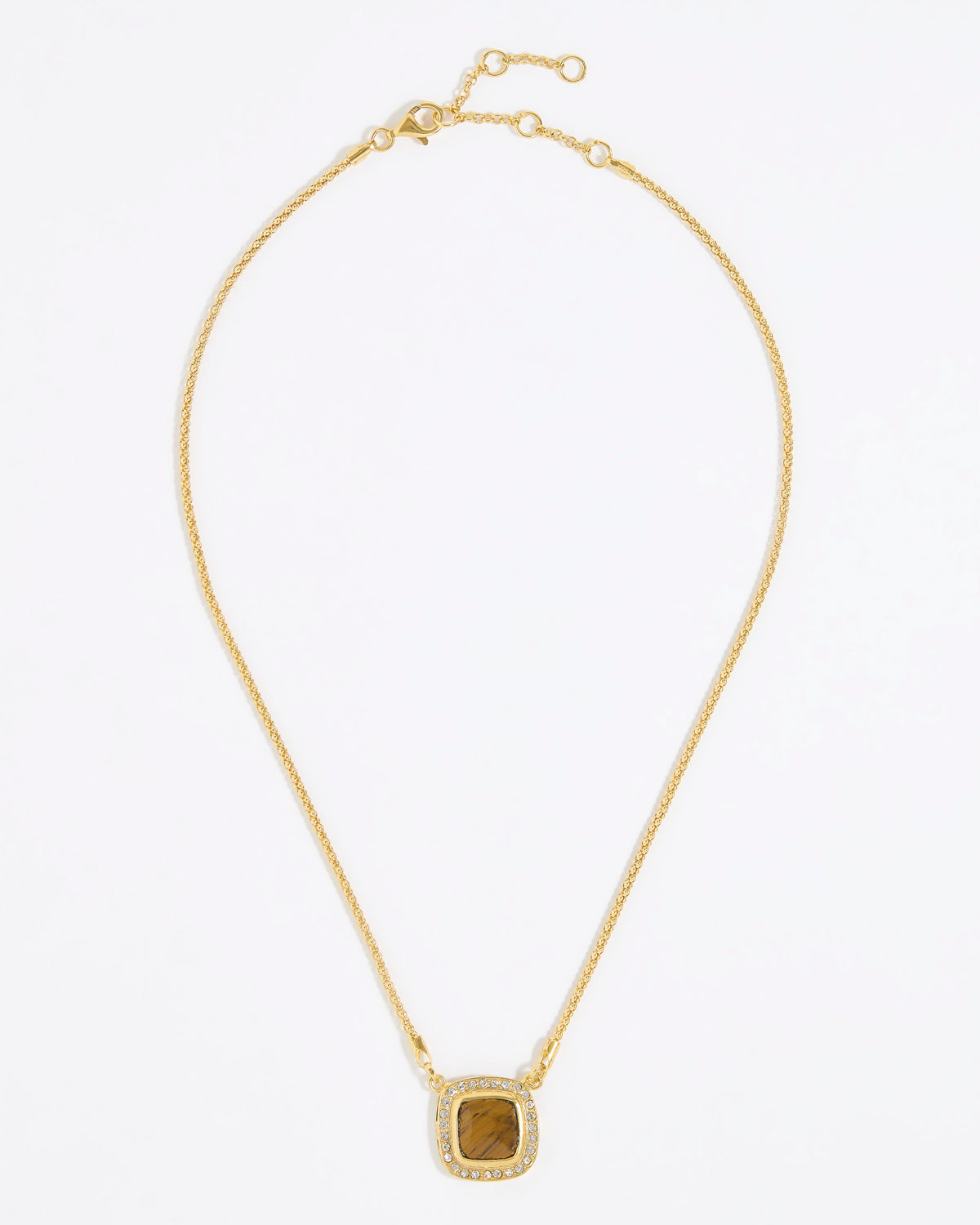 Gold necklace with a square tigers eye stone surrounded by small crystals on a gold chain and white background