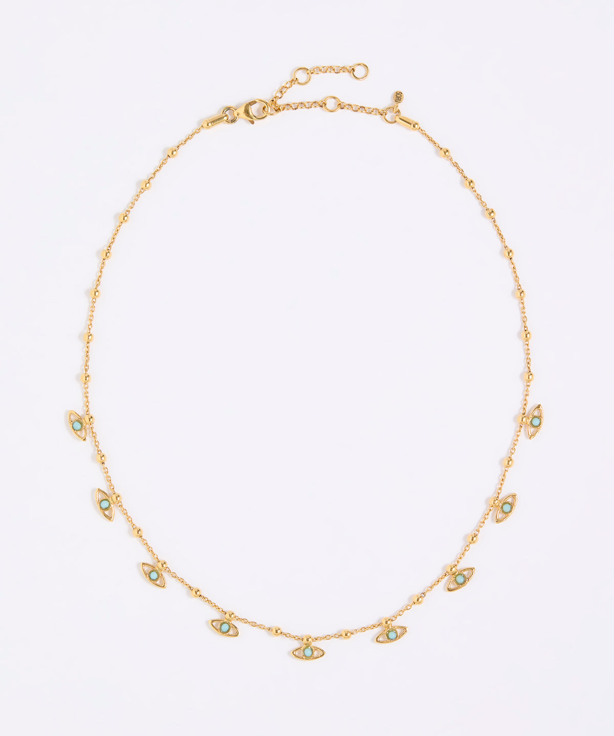 Gold necklace with small eye-shaped charms on a light gray background