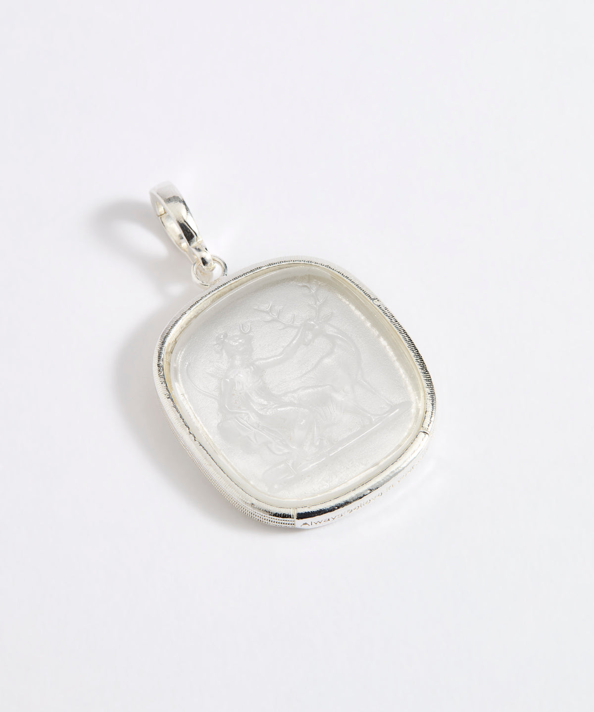 Silver and near clear glass pendant depicting Diana, Goddess of the Hunt. 