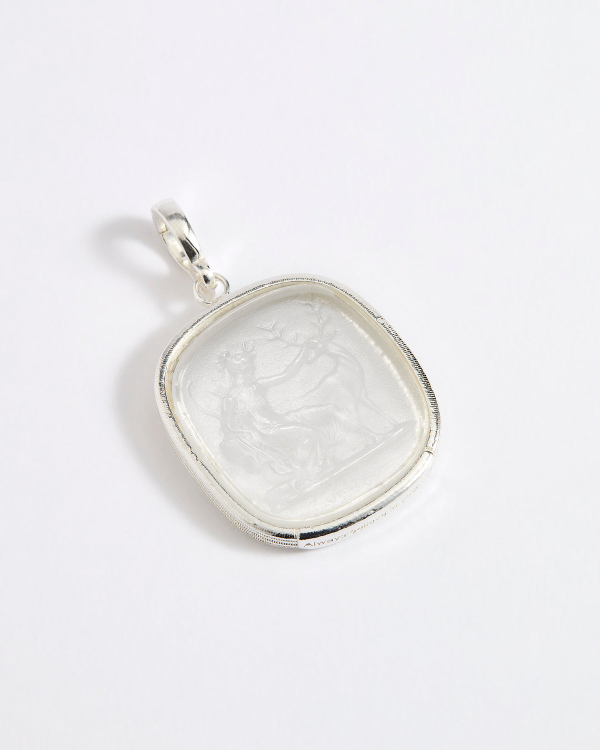 Silver and near clear glass pendant depicting Diana, Goddess of the Hunt. 
