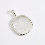 Silver and near clear glass pendant depicting Diana, Goddess of the Hunt. 