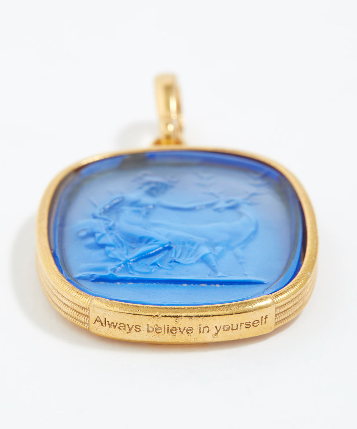 Gold pendant with blue stone and 'Always believe in yourself' engraving on a white background