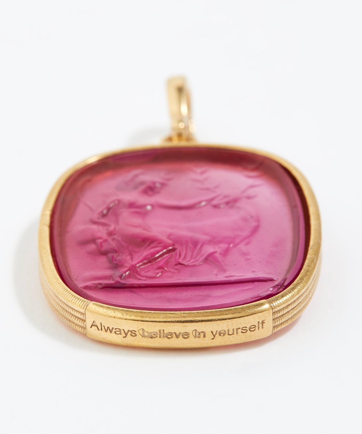 Gold pendant with pink stone and engraved text -"always believe in yourself" on a white background