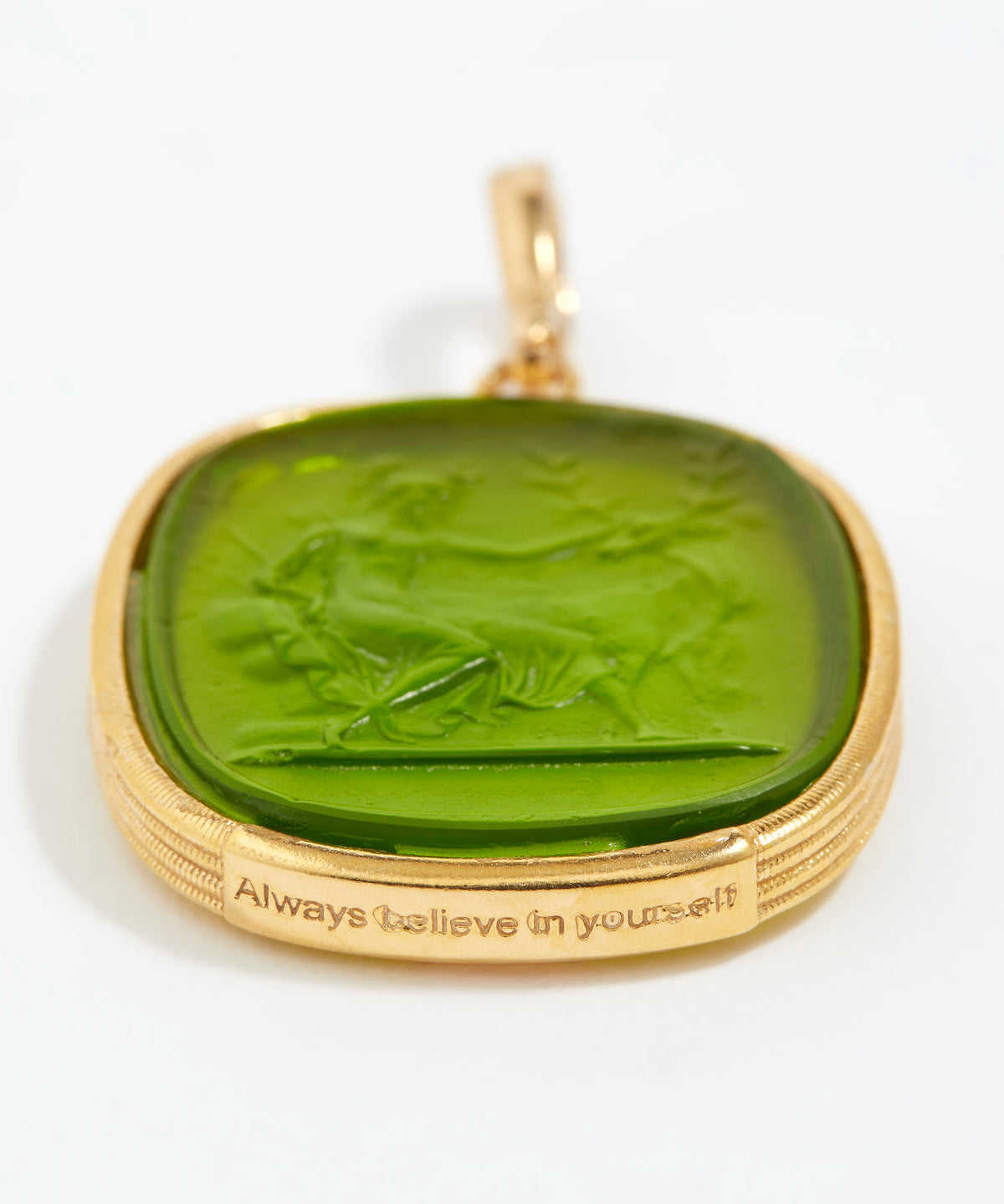 Green stone pendant with gold frame and engraved text  - "always believe in yourself" on a white background