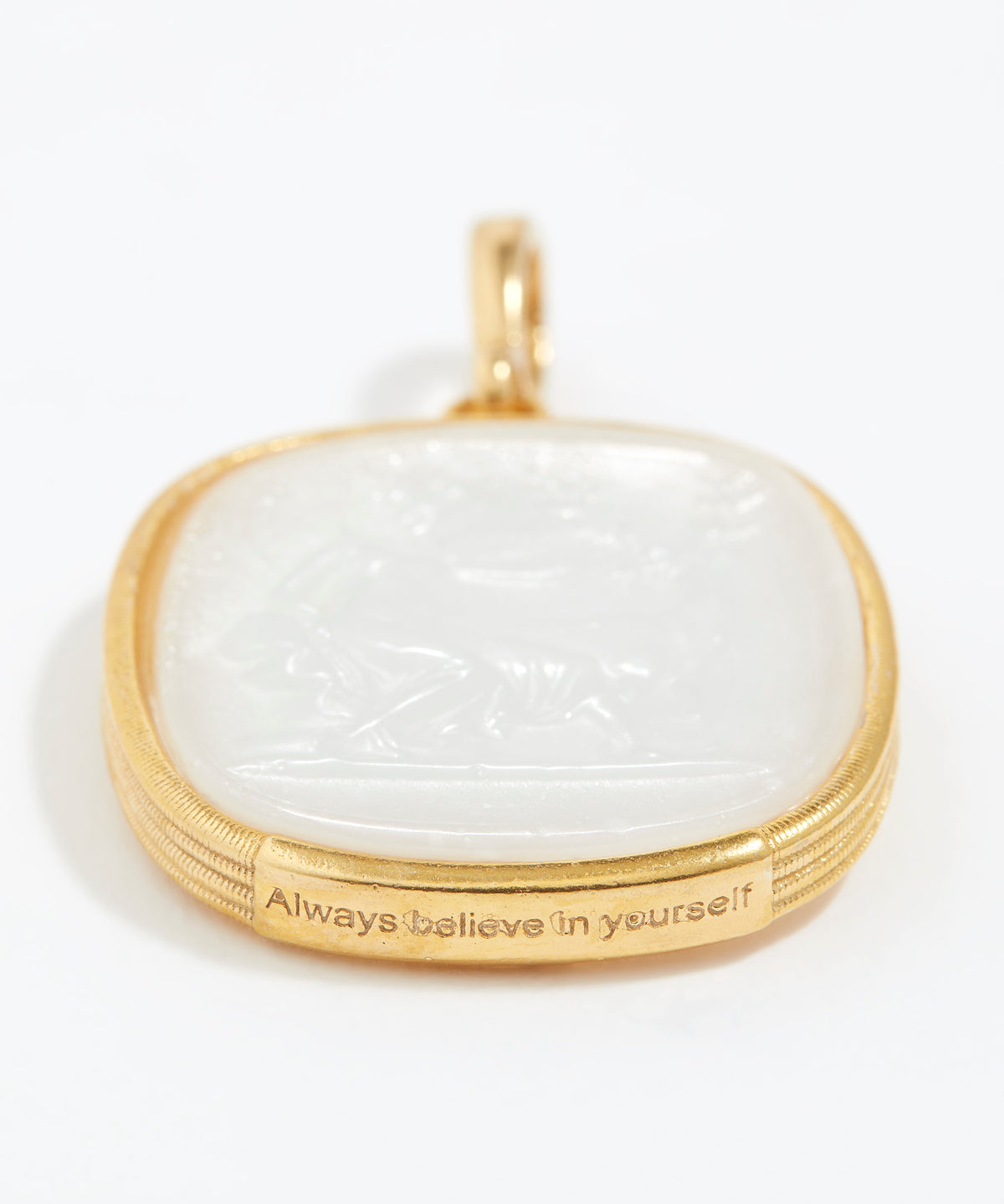 Gold pendant with a white stone and 'Always believe in yourself' engraving on a white background