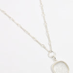 Large silver and near clear glass charm on silver link style necklace 