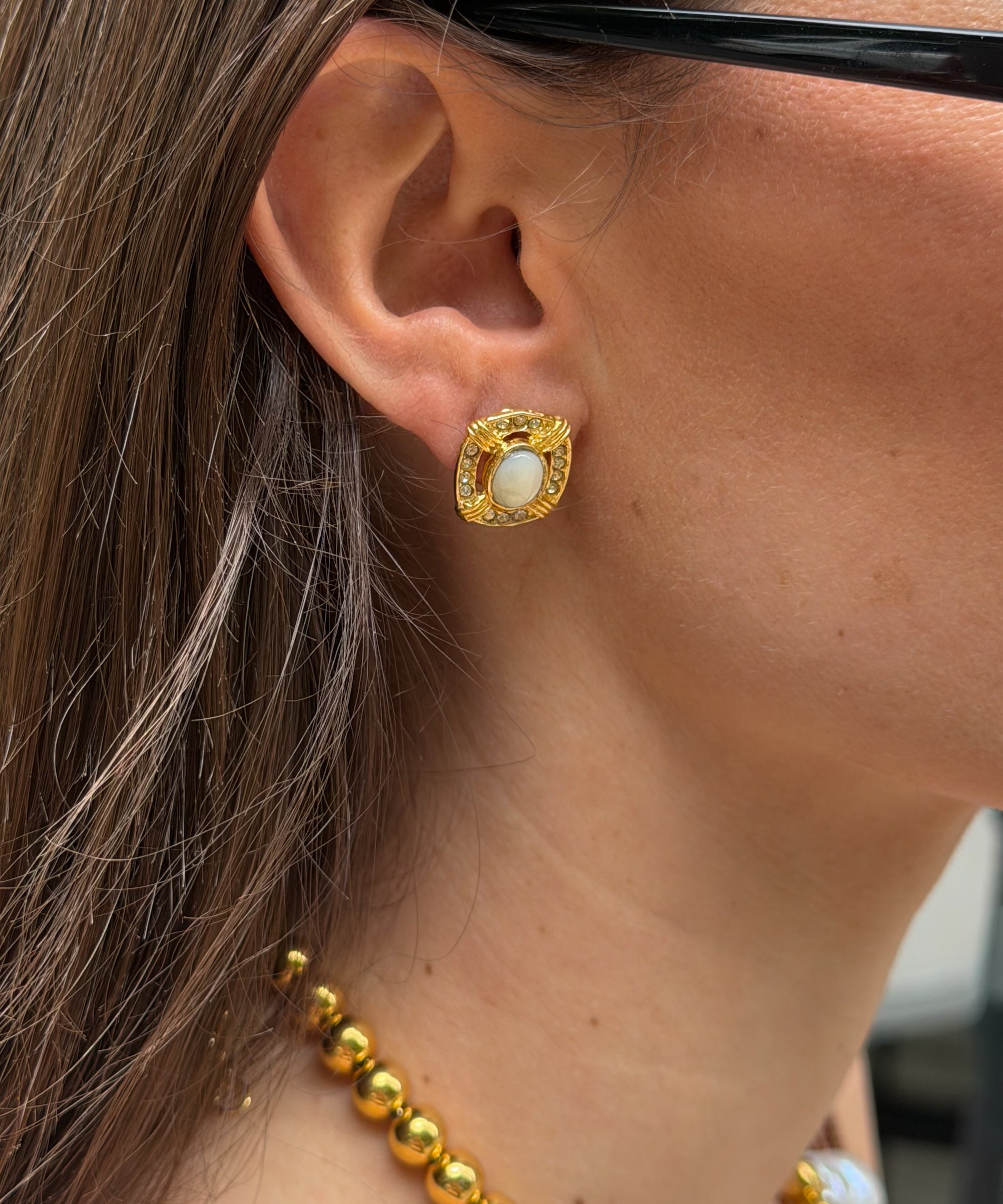 GIRL WEARING GOLD EARRINGS 