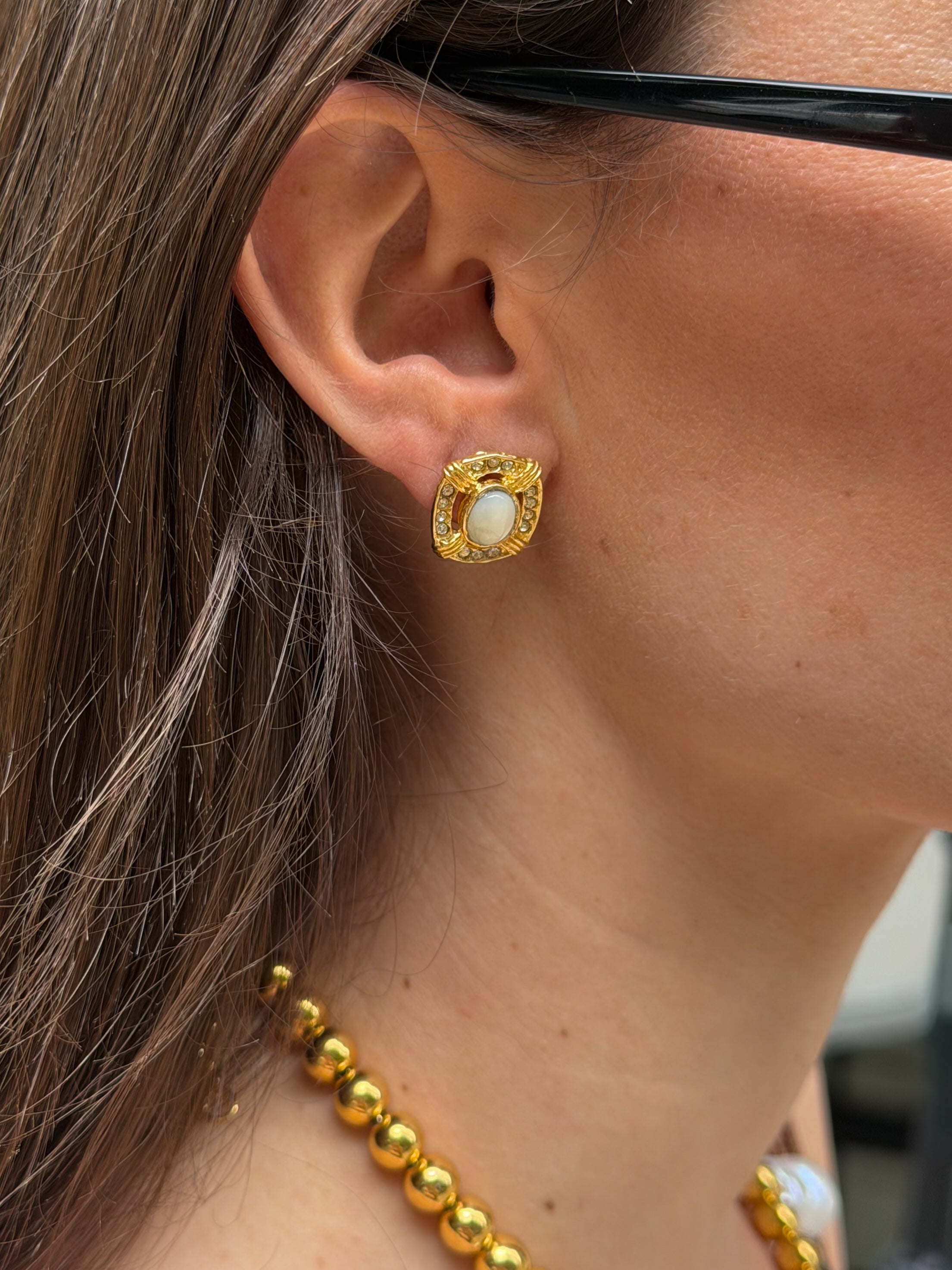 GIRL WEARING GOLD EARRINGS 