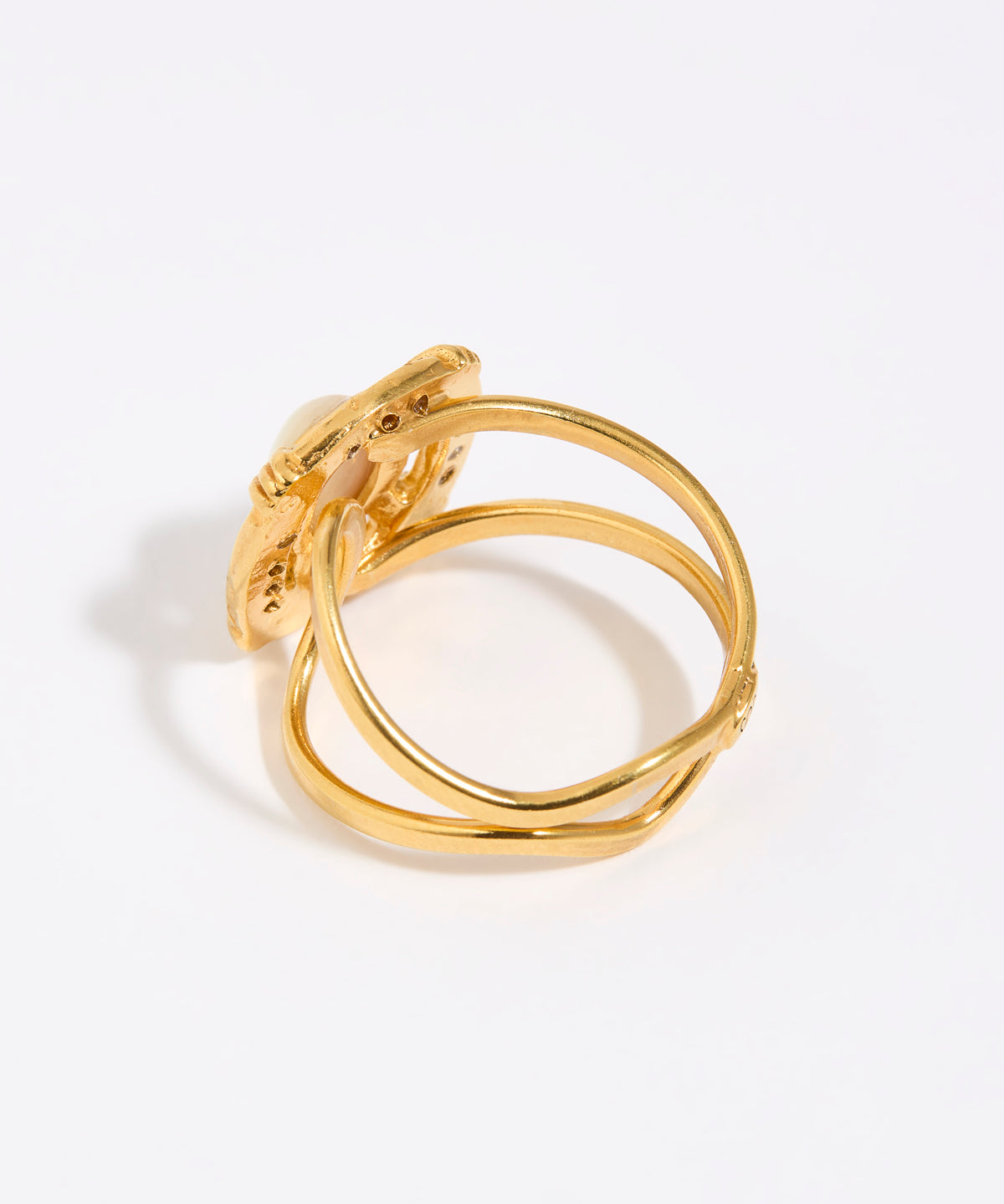 Gold ring with a white background