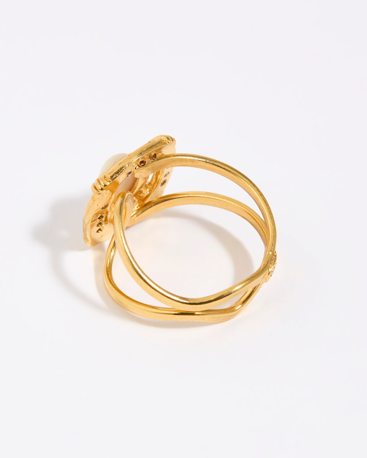 Gold ring with a white background