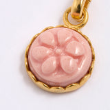 Pink floral pendant with gold frame on a white background