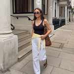on model shot of gold beaded necklace with statement white pearls being worn.