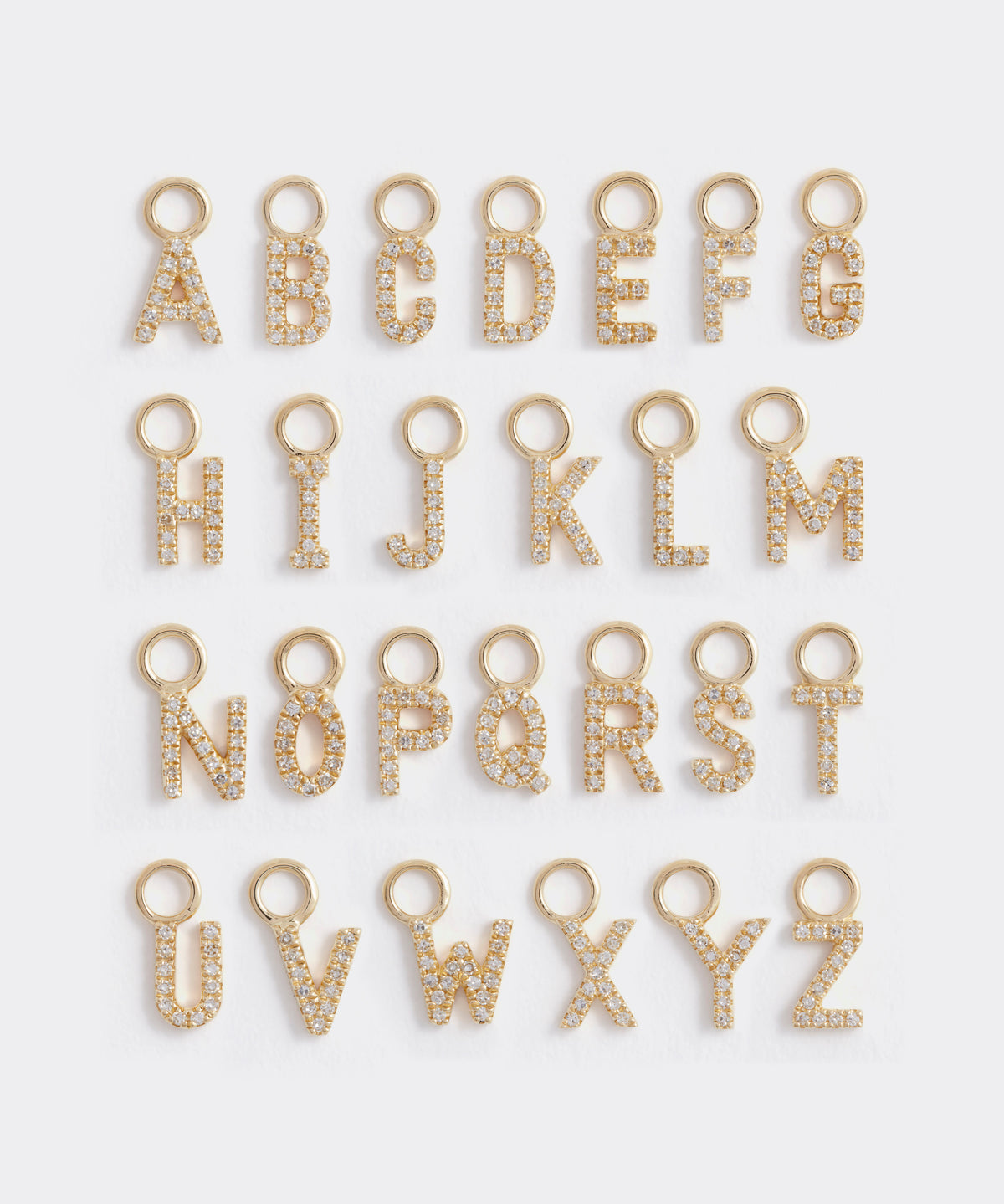 the alphabet of gold and diamond letter charms