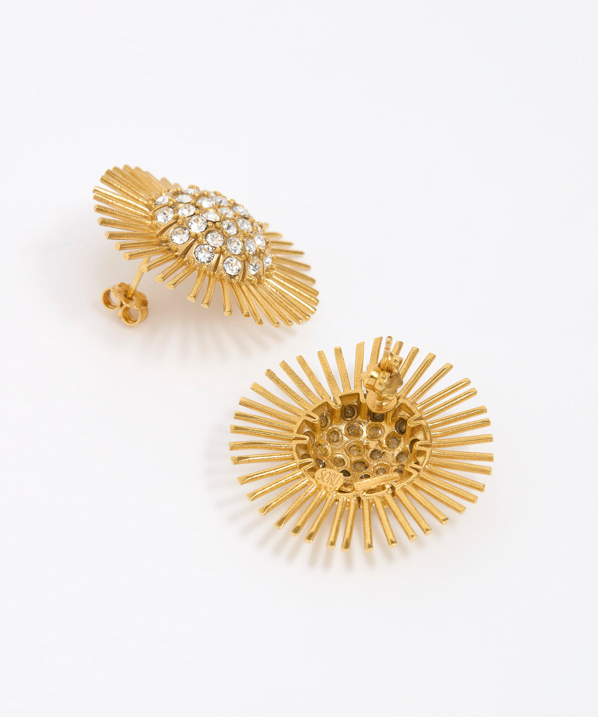 Close-up of side and reverse product shot of gold earrings with starburst design on a white background reverse image