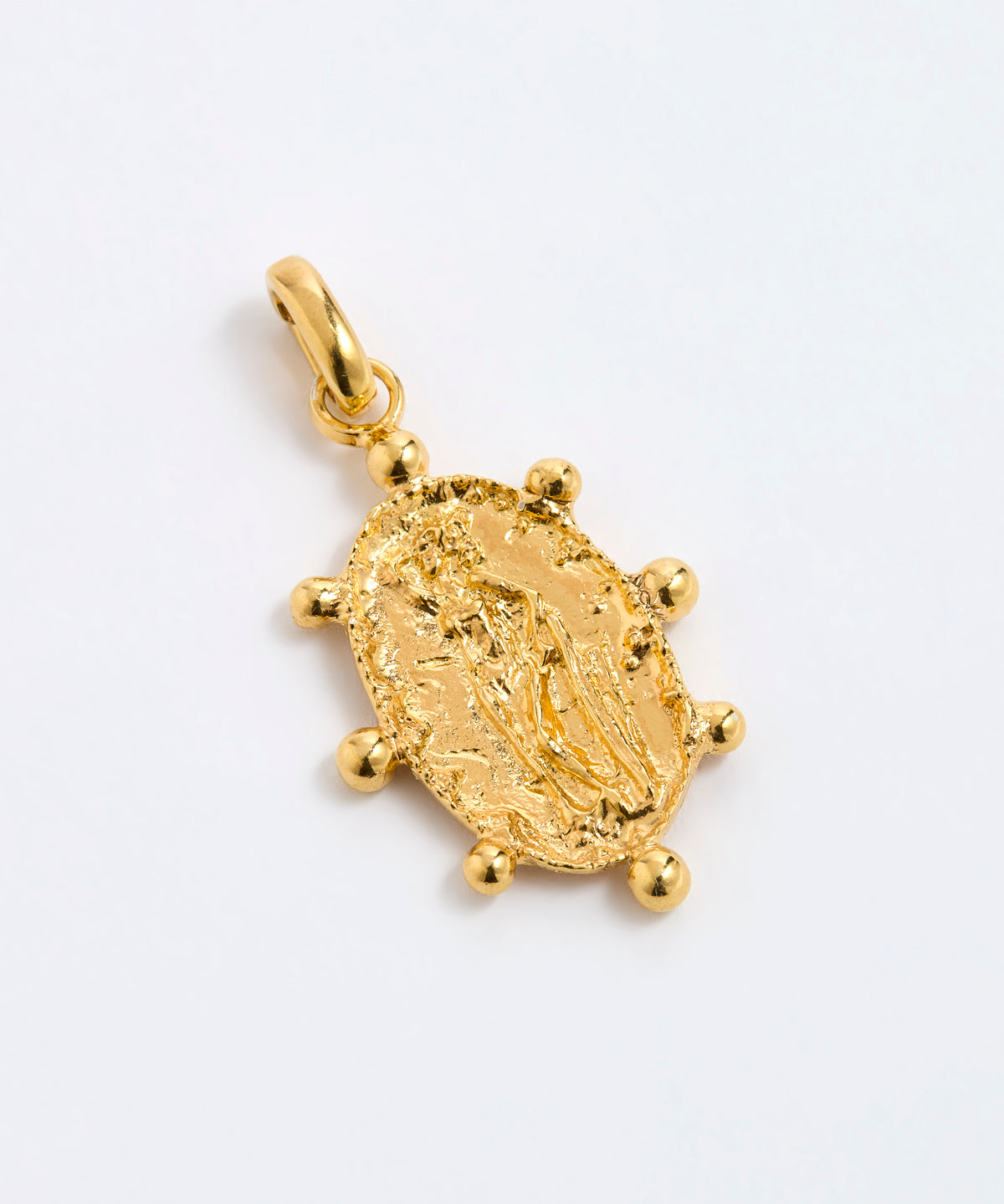Oval, organically finished charm featuring the figure of a woman. Handmade with classic detailing and a decorative gold beaded border, displayed on a white background.