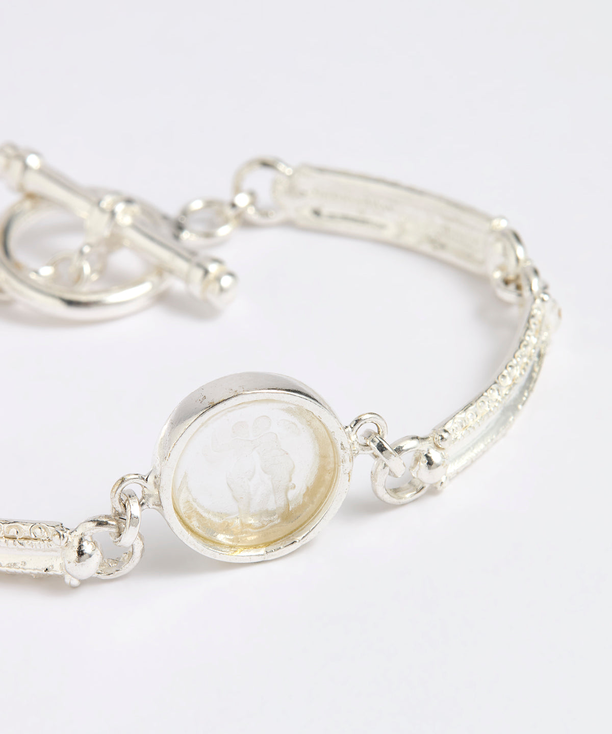 Silver link bracelet with round pendant in the centre with clear glass and embossed image of twins and inscription 'you are loved'