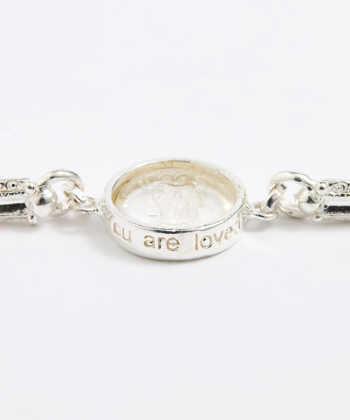 Silver link bracelet with round pendant in the centre with clear glass and embossed image of twins and inscription 'you are loved'