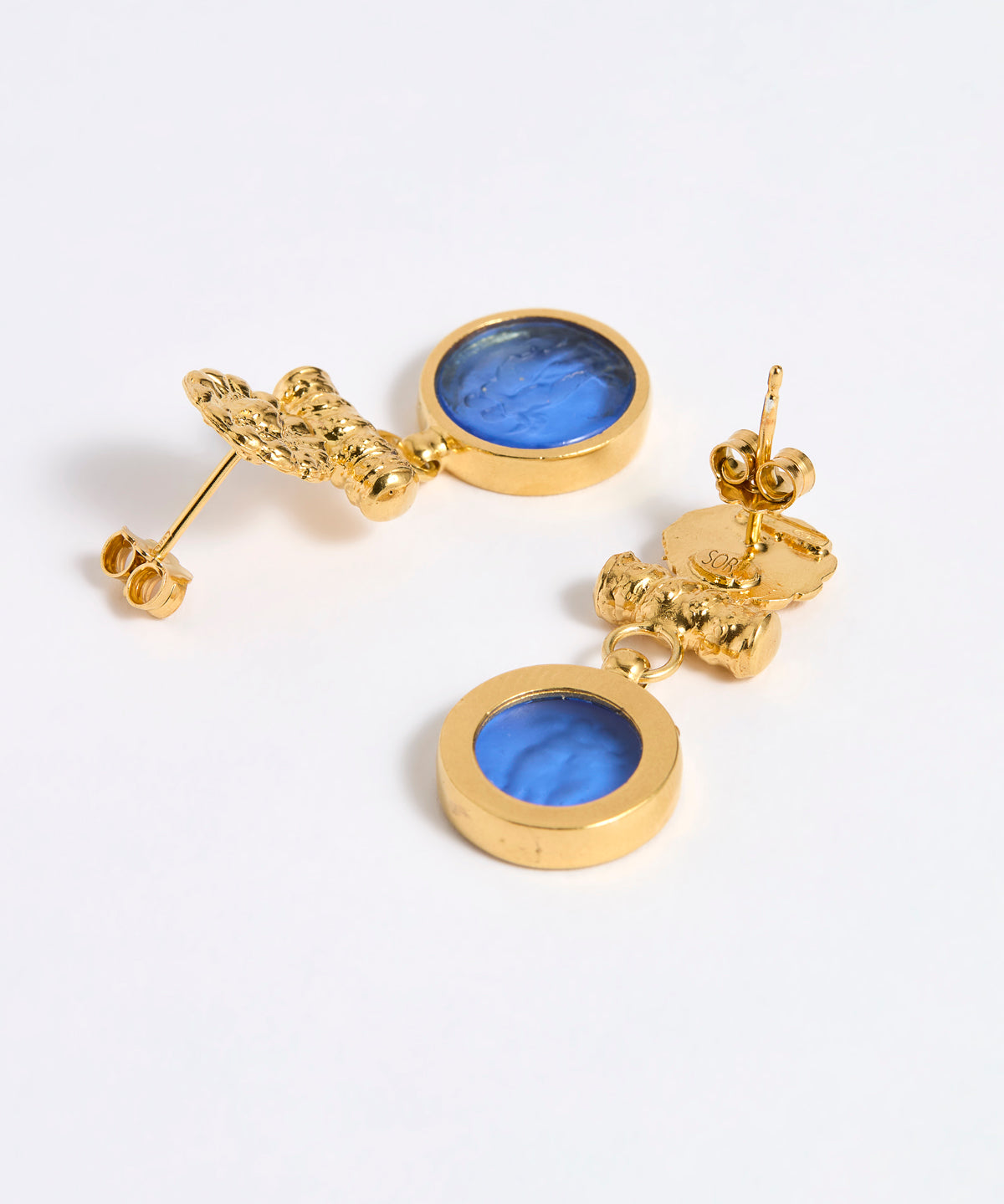 Reverse image of Gold plated  drop earrings with round blue glass pendant featuring an image of twins.