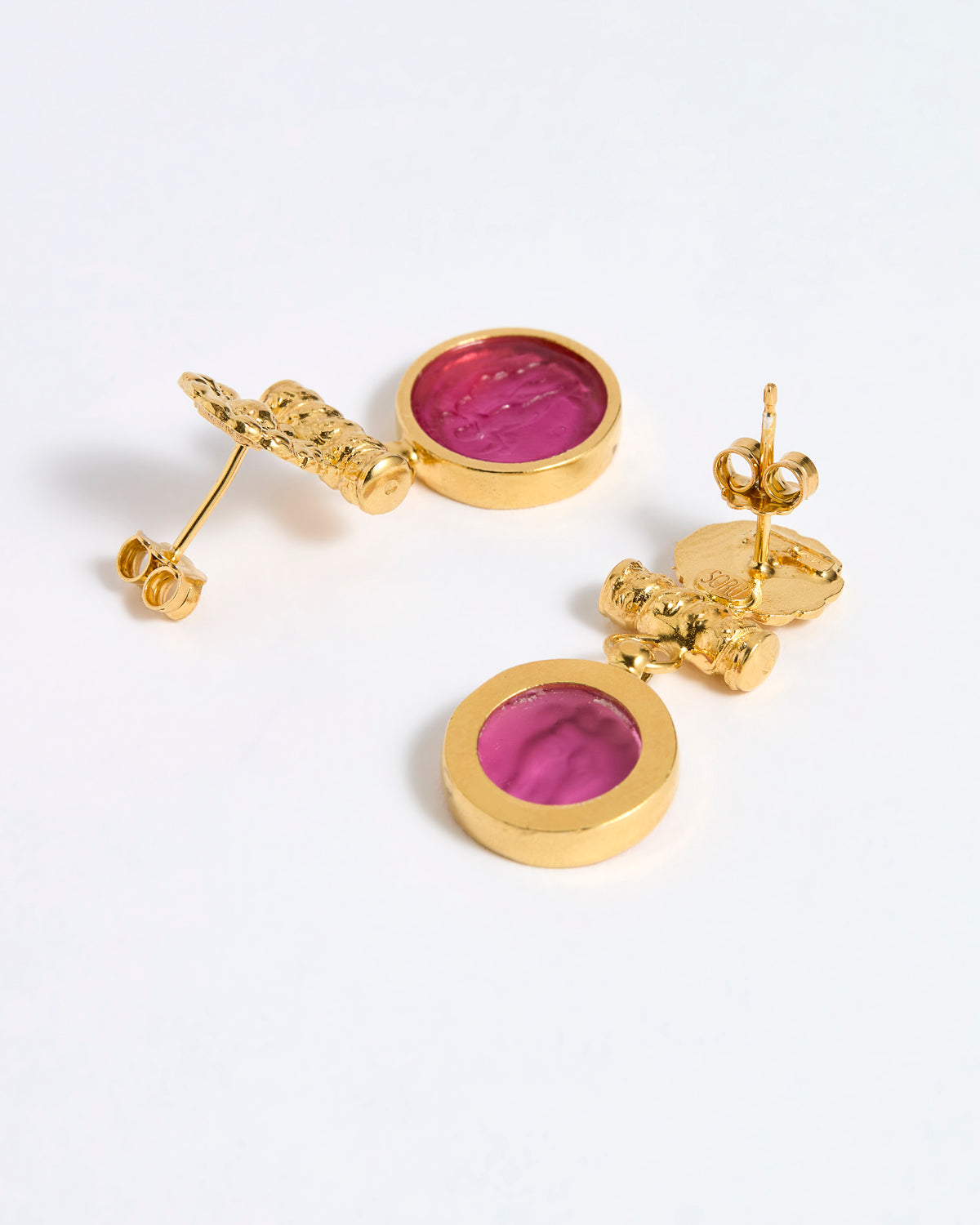 Reverse image of Gold plated  drop earrings with round amber glass pendant featuring an image of twins.