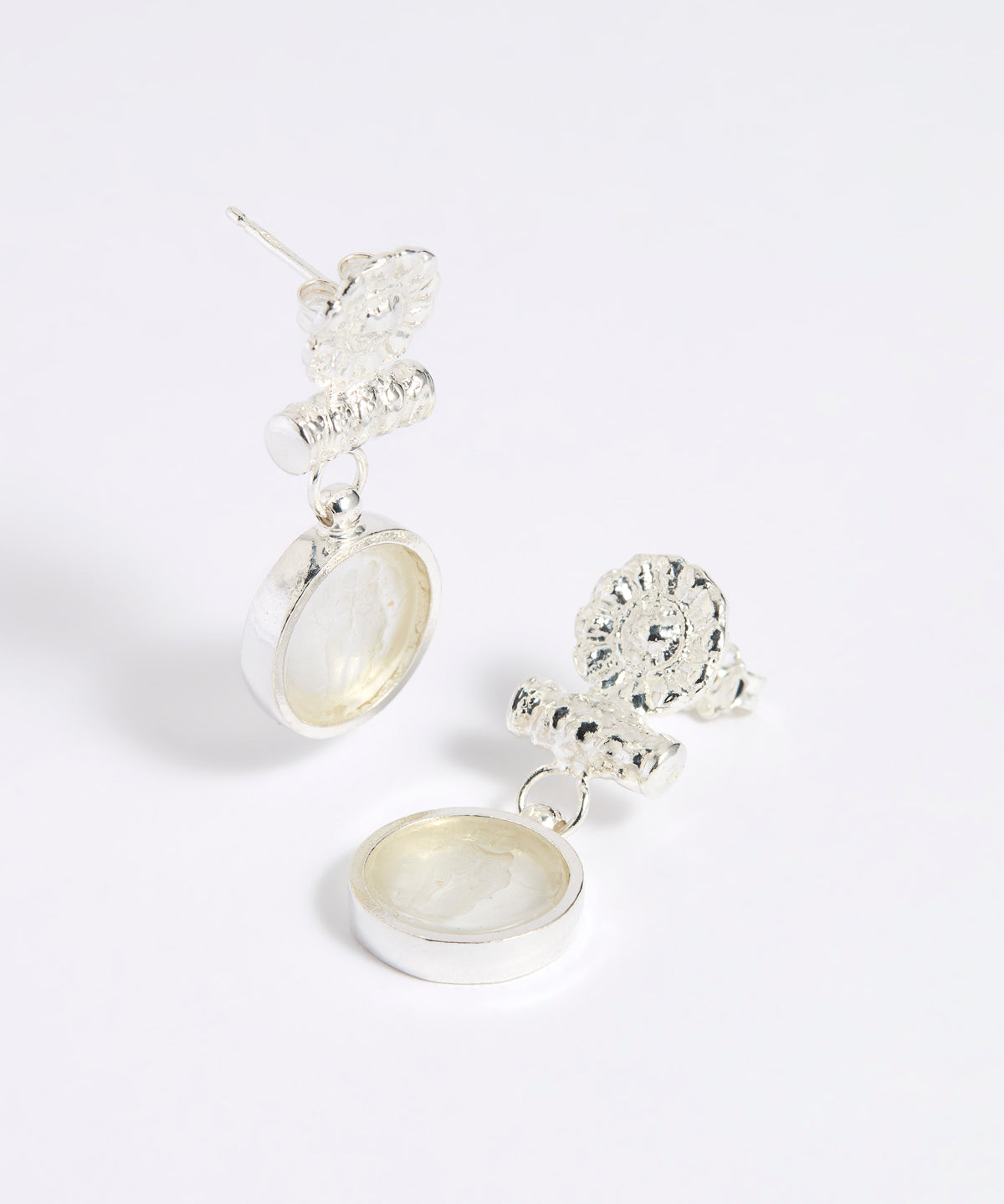 Silver drop earrings with round clear glass pendant featuring an image of twins.