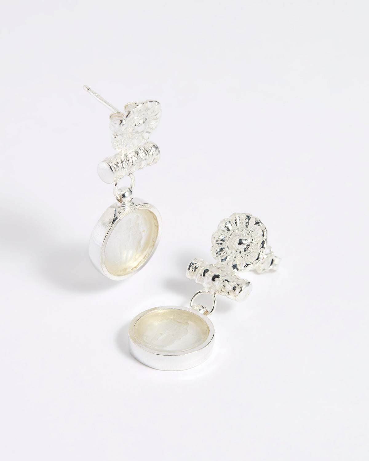 Silver drop earrings with round clear glass pendant featuring an image of twins.