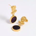 Gold plated  drop earrings with round violet glass pendant featuring an image of twins.