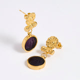 Gold plated  drop earrings with round violet glass pendant featuring an image of twins.