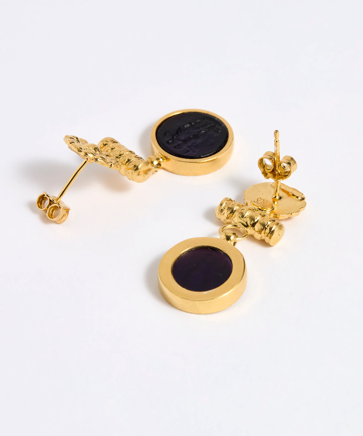 Reverse image of Gold plated  drop earrings with round violet glass pendant featuring an image of twins.