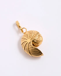 Gold coloured shell shaped pendant on a white background