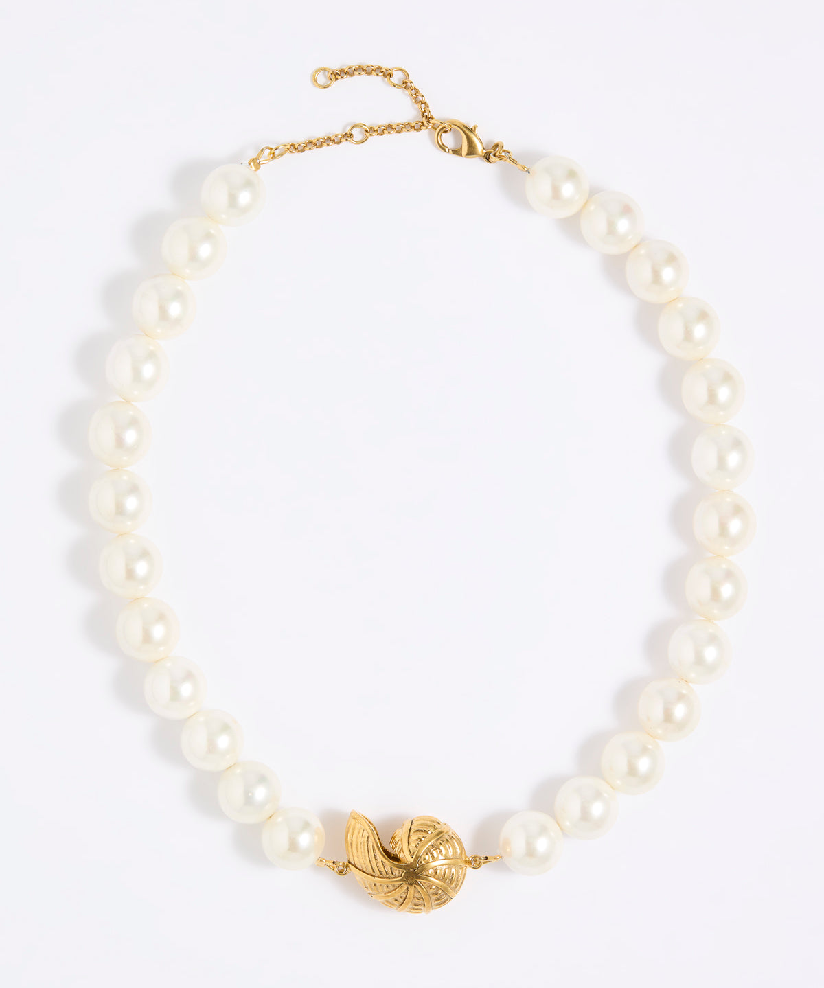 Pearl necklace with statement shell pendant  on a white background