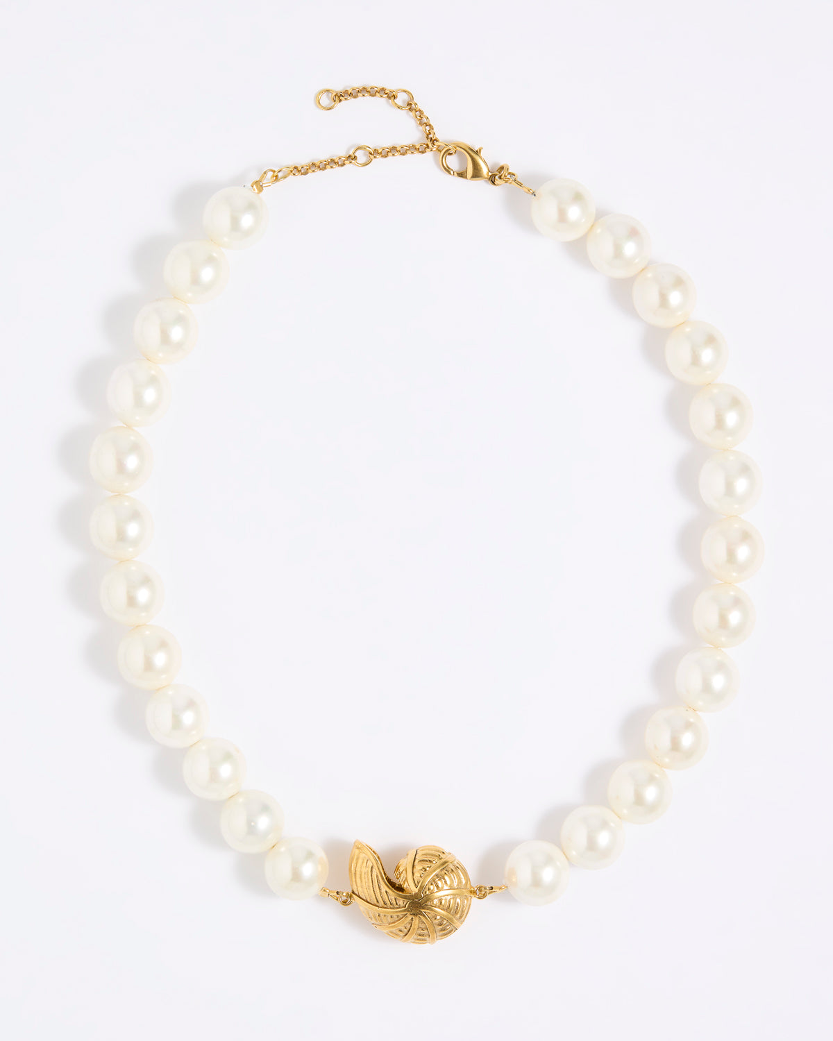 Pearl necklace with statement shell pendant  on a white background