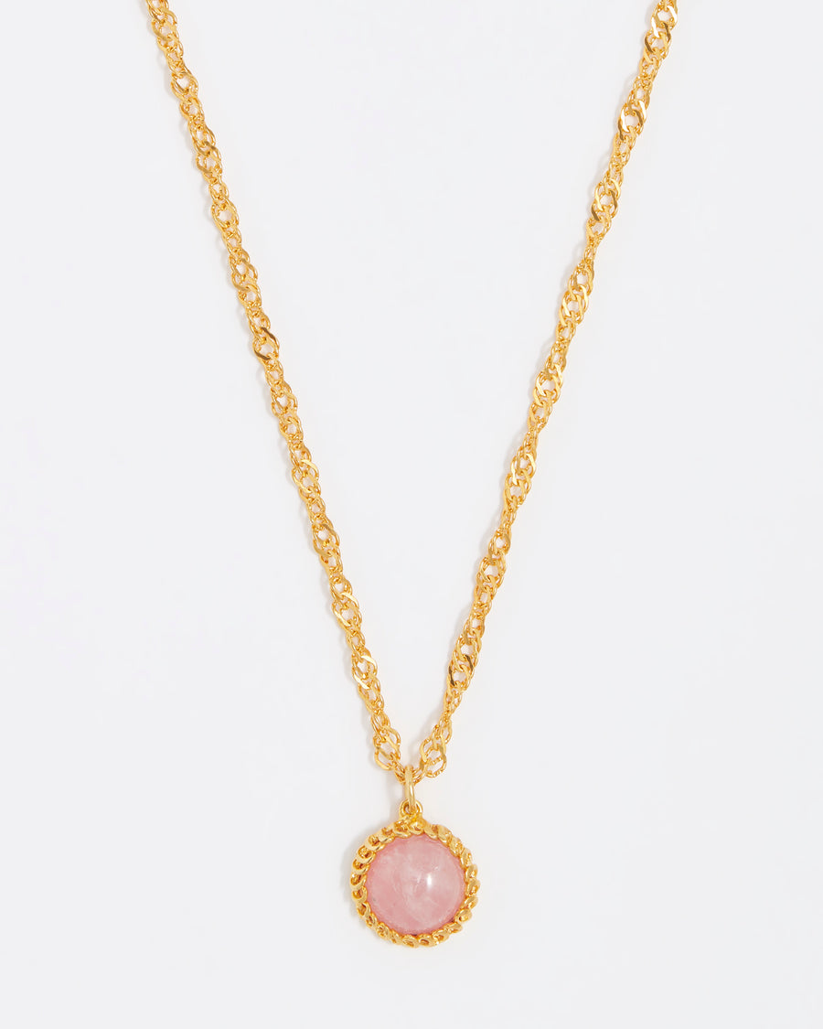 close up shot of the PINK ROSE QUARTZ pendant on a gold twisted chain